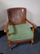 An early 20th century beech framed armchair