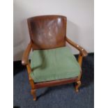 An early 20th century beech framed armchair