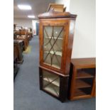 A 19th century stained pine corner cabinet