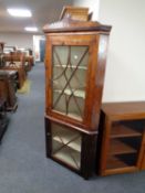 A 19th century stained pine corner cabinet
