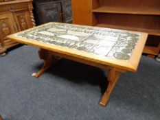 A continental oak coffee table with tile top