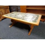 A continental oak coffee table with tile top