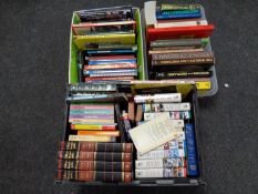 Three boxes containing books, reference guides,