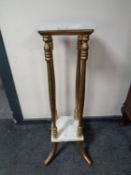 A marble topped two tier plant stand