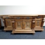 A 19th century light oak breakfronted sideboard