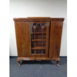 An early 20th century mahogany bookcase fitted with three doors