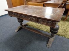 A continental oak table with under stretcher