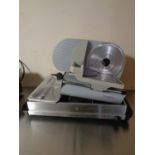 A meat slicer and a warming plate