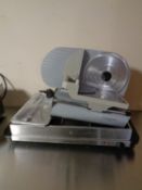 A meat slicer and a warming plate