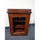 An Edwardian mahogany smoker's cabinet with glazed door