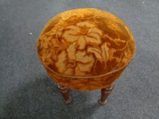 An antique upholstered stool