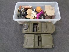 Two plastic military model vehicles together with a further plastic crate containing further toys