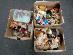 Three boxes containing a quantity of dolls and doll's house furniture