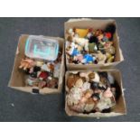 Three boxes containing a quantity of dolls and doll's house furniture