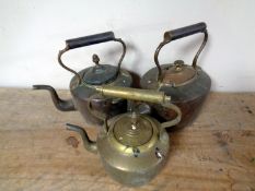 Three antique copper and brass kettles