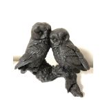 A bronzed resin figure of two owls by J Spouse