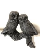 A bronzed resin figure of two owls by J Spouse