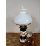 An Italian ceramic lamp with glass shade and matching ash tray