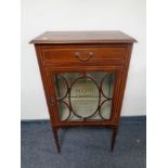 An Edwardian inlaid mahogany display cabinet with later Chanel decoration