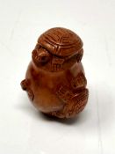 A carved Chinese hardwood netsuke - Turtle family in a pot