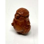 A carved Chinese hardwood netsuke - Turtle family in a pot