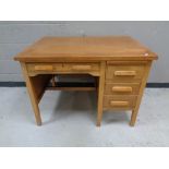 A 1930s oak pedestal desk