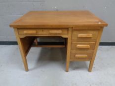 A 1930s oak pedestal desk