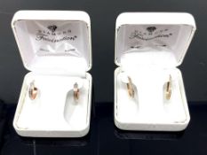 Two pairs of 14ct gold earrings, boxed.