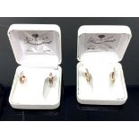 Two pairs of 14ct gold earrings, boxed.