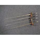 Four ornamental fencing foils