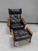 A 20th century continental beech framed leather wingback armchair with matching stool