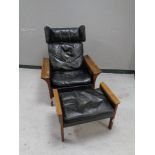 A 20th century continental beech framed leather wingback armchair with matching stool