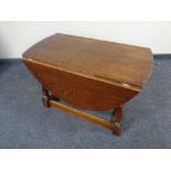 An oak drop leaf coffee table