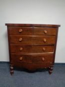 A Victorian mahogany five drawer bow fronted chest