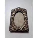 An embossed silver photo frame,