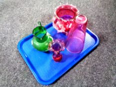 A tray containing four pieces of antique glassware to include a hand painted green glass jug,