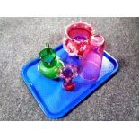 A tray containing four pieces of antique glassware to include a hand painted green glass jug,