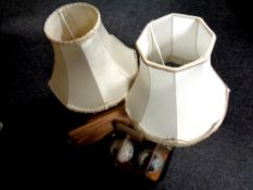 A tray containing pair of globe bookends, two turned wooden table lamps,