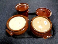 A tray of English brown glazed earthenware pots