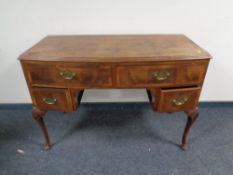 A walnut dressing table on cabriole legs