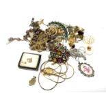 A small collection of costume jewellery, brooches,