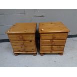 A pair of contemporary pine three drawer bedside chests