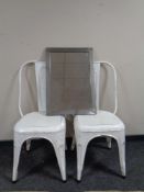 Two painted metal chairs together with a metal framed mirror