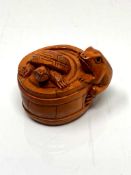 A carved Chinese hardwood netsuke - Turtle and frog in barrel