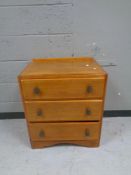 A 1930s oak three drawer chest