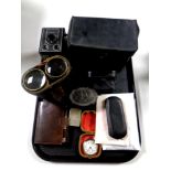 A tray containing Ingersol pocket watch, vintage spectacles, cased opera glasses, Polaroid camera,