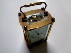 A brass cased French carriage clock with platform escapement and key