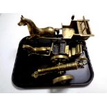 A tray containing two brass horse and cart figures together with a brass model of a cannon