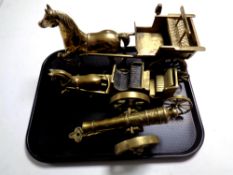 A tray containing two brass horse and cart figures together with a brass model of a cannon