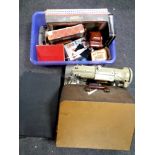 A box containing vintage puzzles and games, vintage tins, together with a suitcase, oil on board,